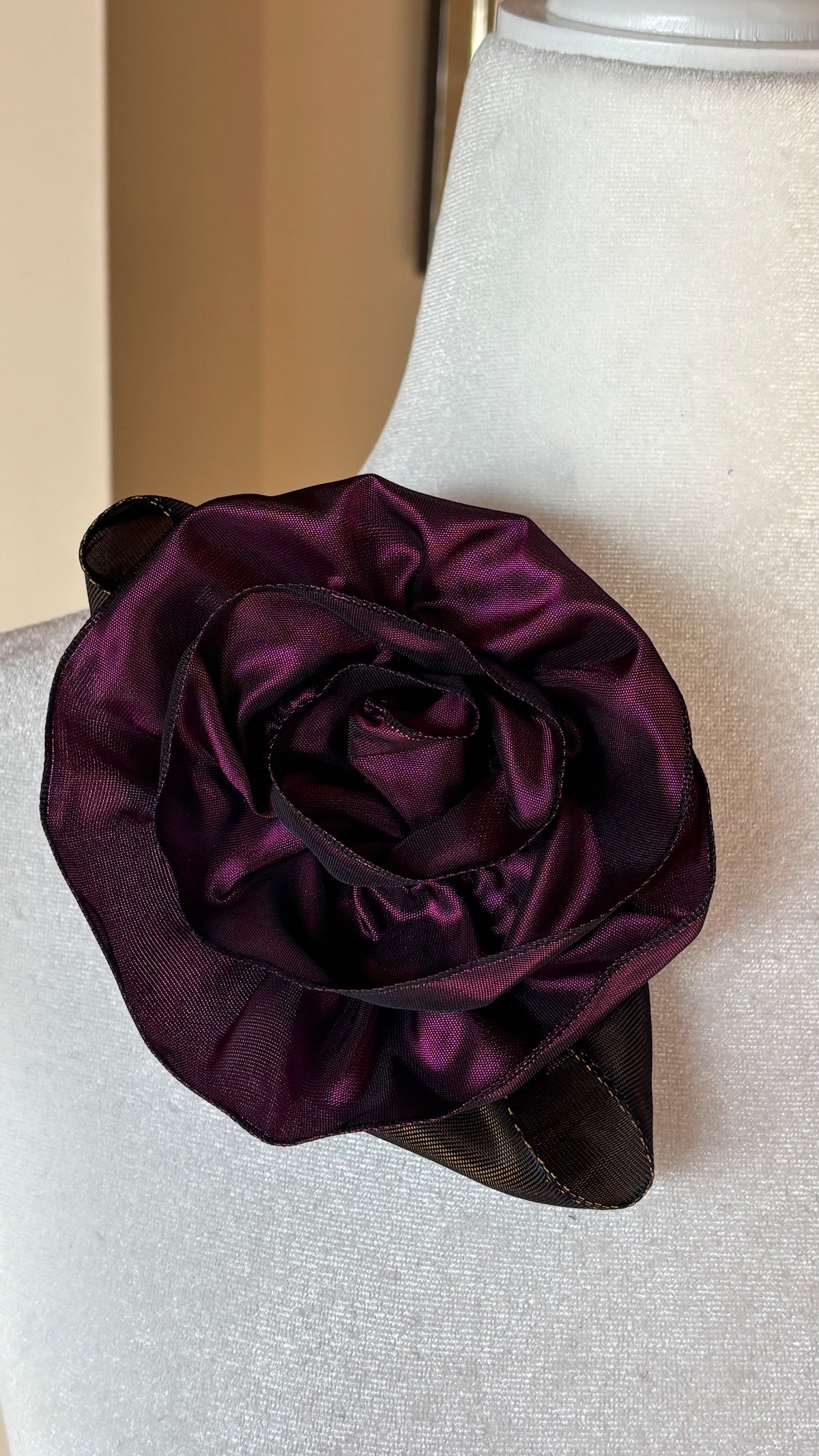 “Rosette” Brooch & Clip Plum. Pin or Clip to dresses, lapels, purse, hat or wear as a boutonniere. Made in the USA. You can reshape the flower and leaves to make it larger or smaller.