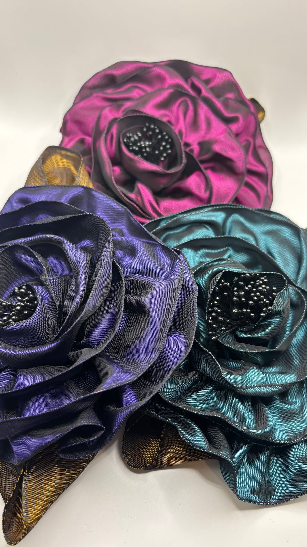“Rosette” Brooch & Clip in Purple.  Pin or Clip to dresses, lapels, handbag or hat.  Made in the USA.  You can reshape the flower and leaves.