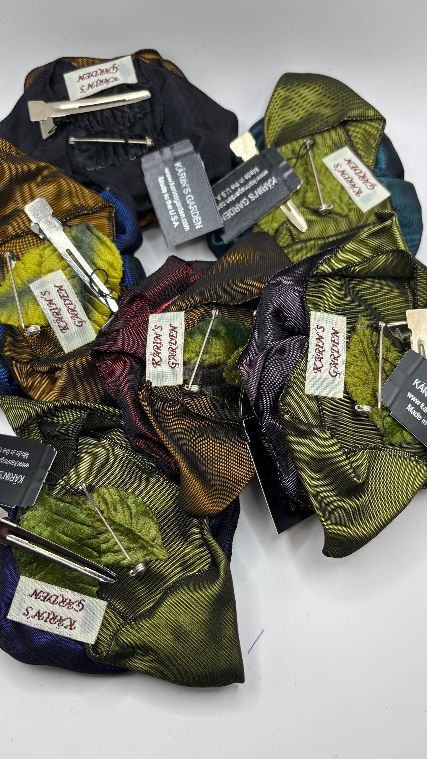 “Rosette” Navy Brooch & Clip.  Pin or Clip to dresses, lapels, purse, hat or wear as a boutonniere. Made in the USA.  You can reshape the flower and leaves to make it larger or smaller.