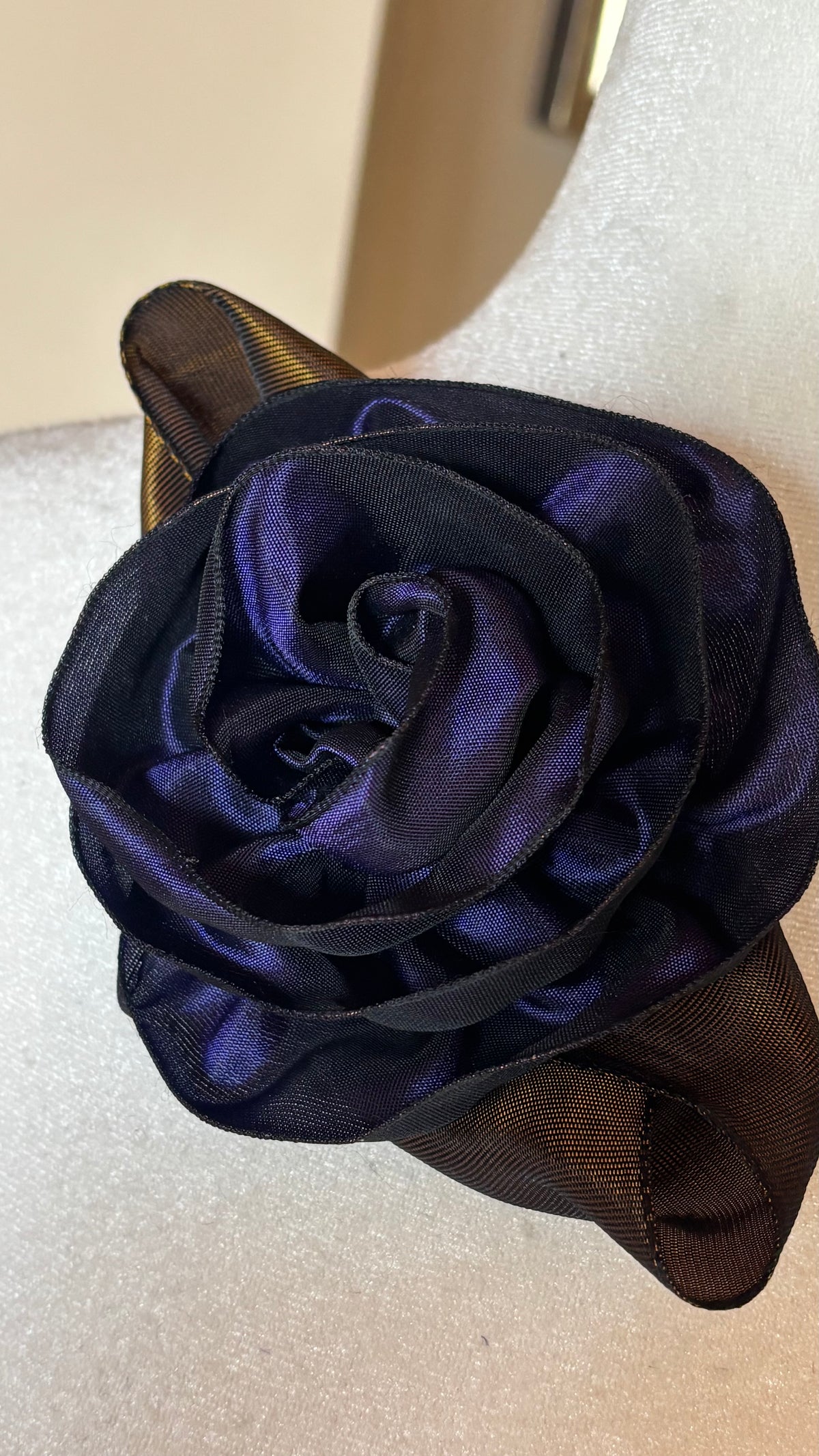 “Rosette” Brooch & Clip in Purple.  Pin or Clip to dresses, lapels, purse, hat or wear as a boutonniere. Made in the USA.  You can reshape the flower and leaves to make it larger or smaller.