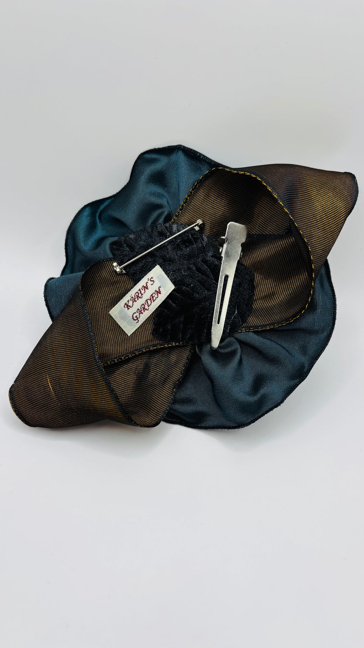 Francesca Petite Brooch & Clip in Aubergine.  Pin or Clip to dresses, lapels, handbag or hat.  Made in the USA.  You can reshape the flower and leaves.  Taffeta from France.