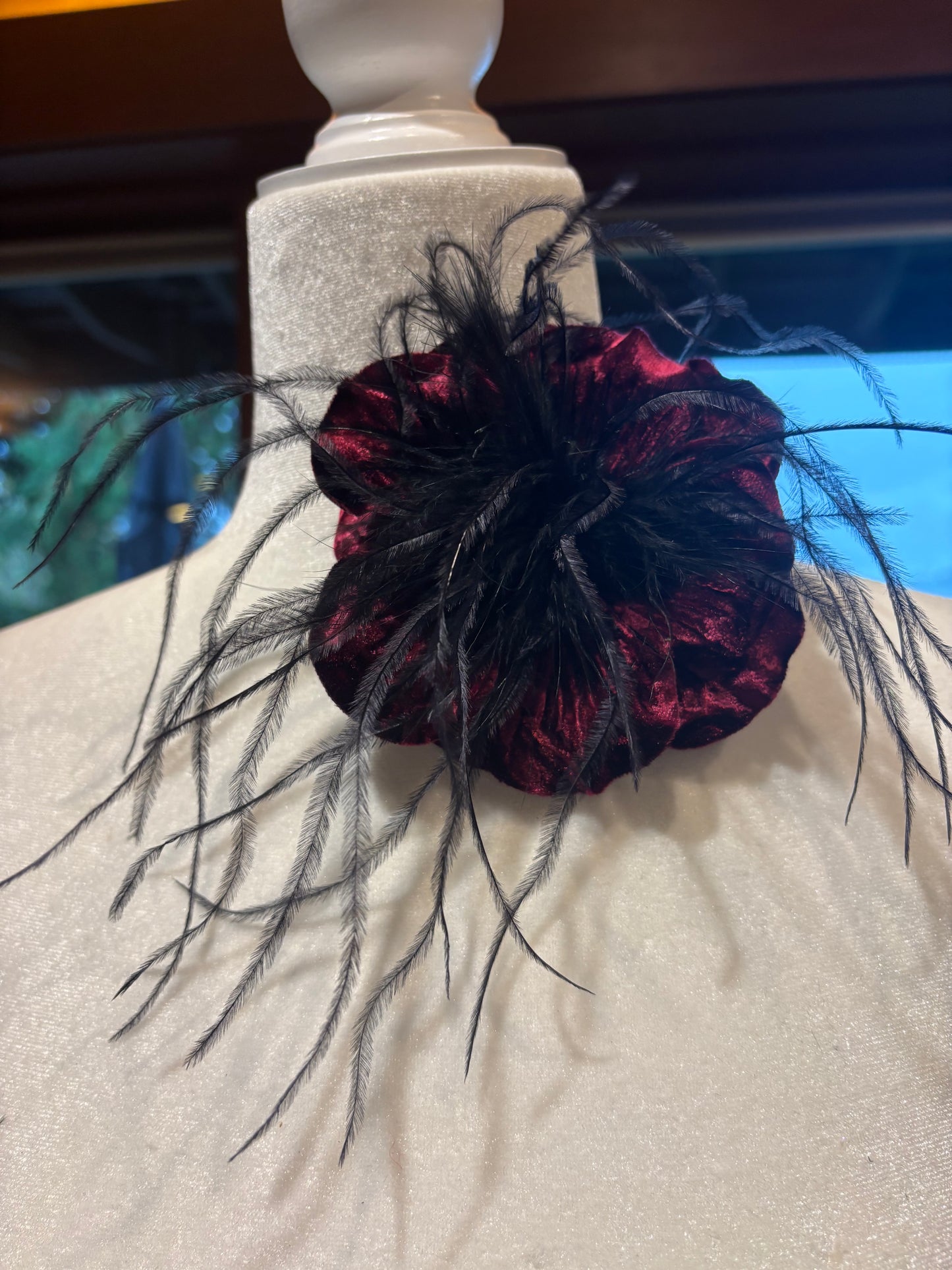“Kitty" Burgundy Velvet Ostrich Flower Pin and Clip. Clip into hair, onto purse, dress, hat, wrist and more. A versatile accessory.