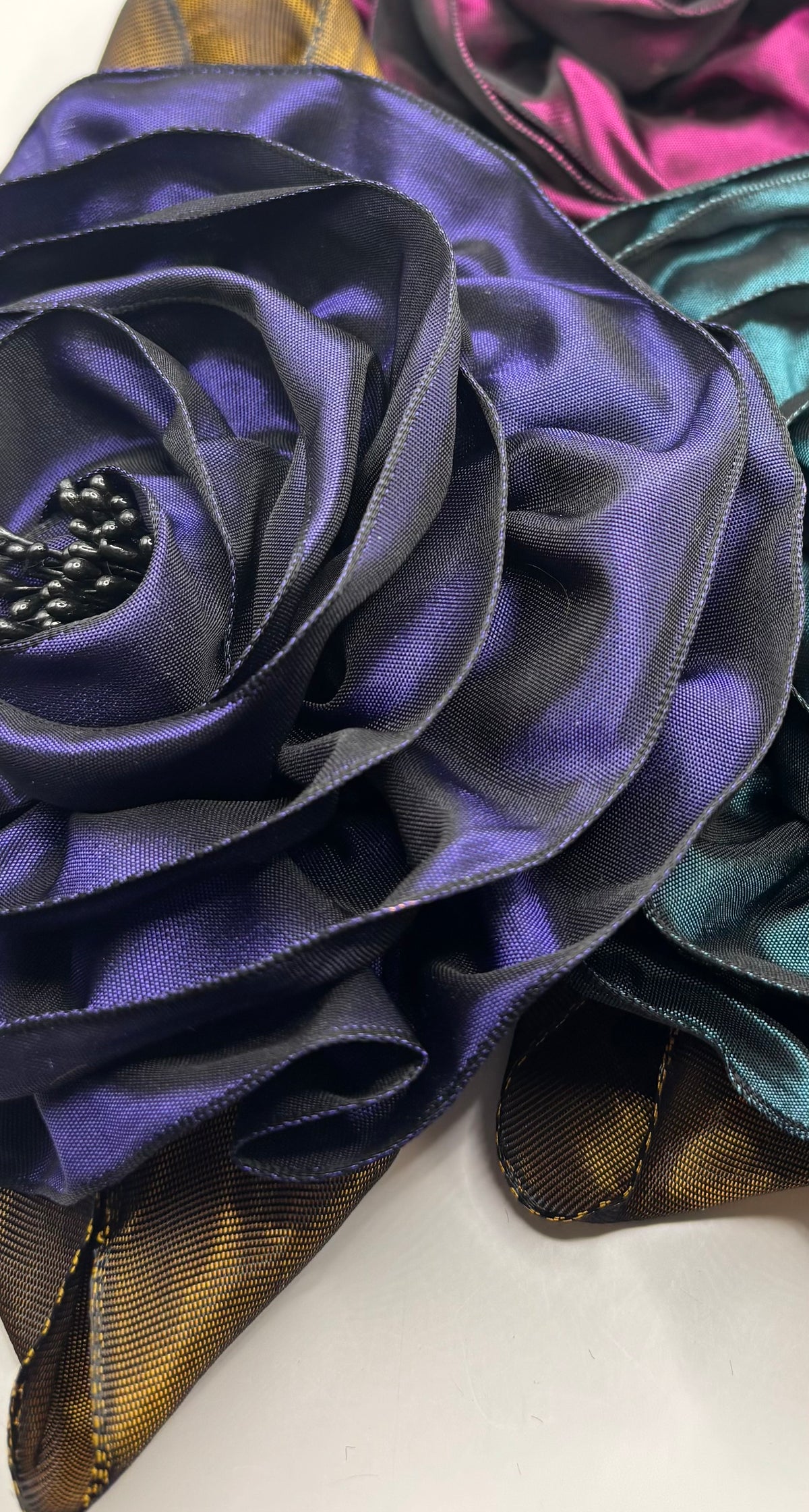 “Rosette” Brooch & Clip in Purple.  Pin or Clip to dresses, lapels, handbag or hat.  Made in the USA.  You can reshape the flower and leaves.