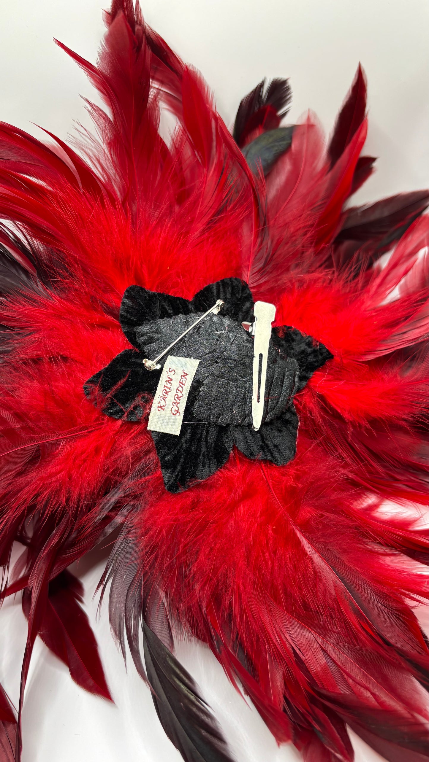“Abracadabra” Red & Black Feather Brooch & Clip.  12" Pin or Clip to lapel, dress, blazer, clip onto wrist elastic, jacket, handbag, hair, hat and more.