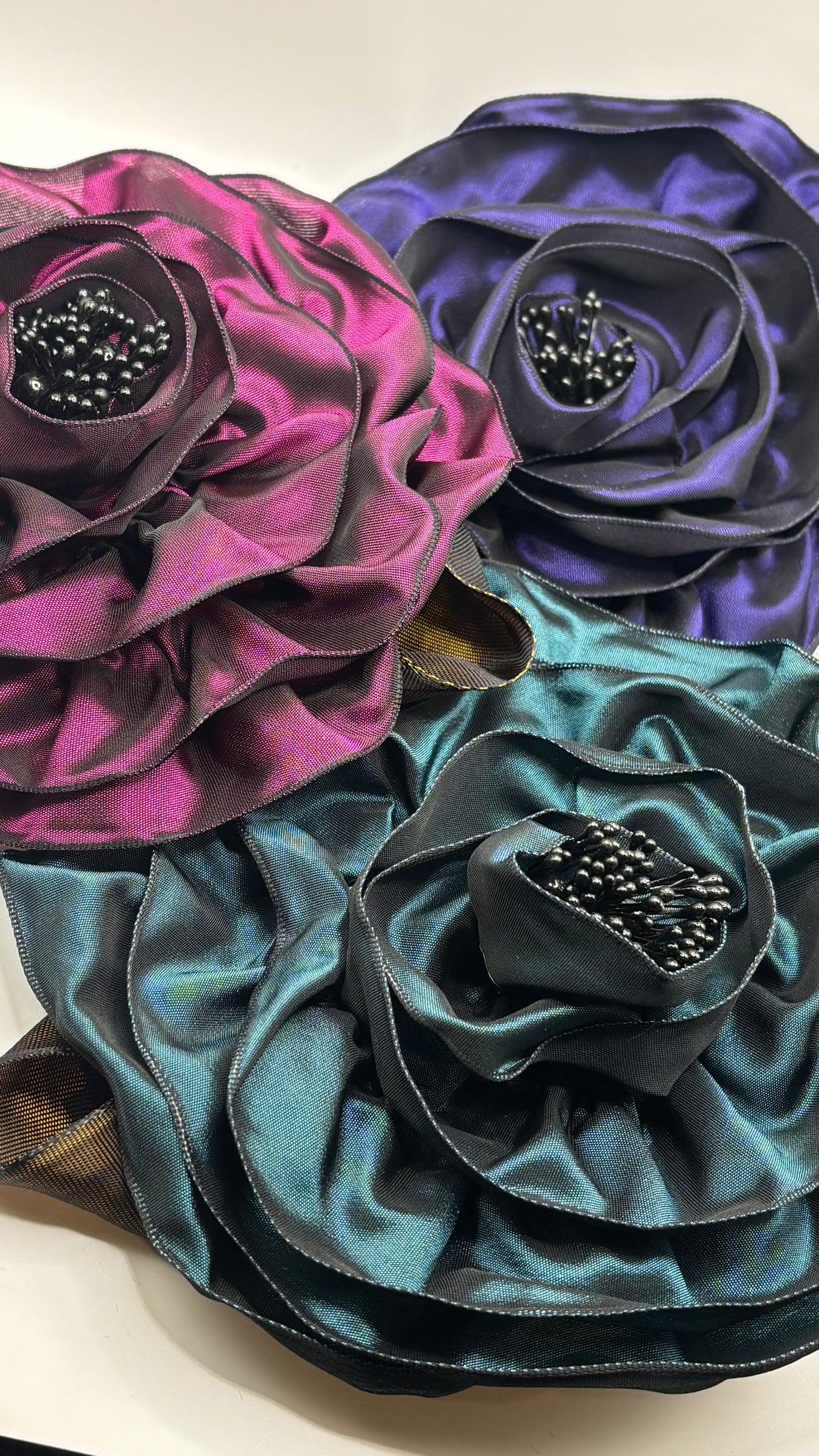“Rosette” Brooch & Clip in Plum.  Pin or Clip to dresses, lapels, handbag or hat.  Made in the USA.  You can reshape the flower and leaves.