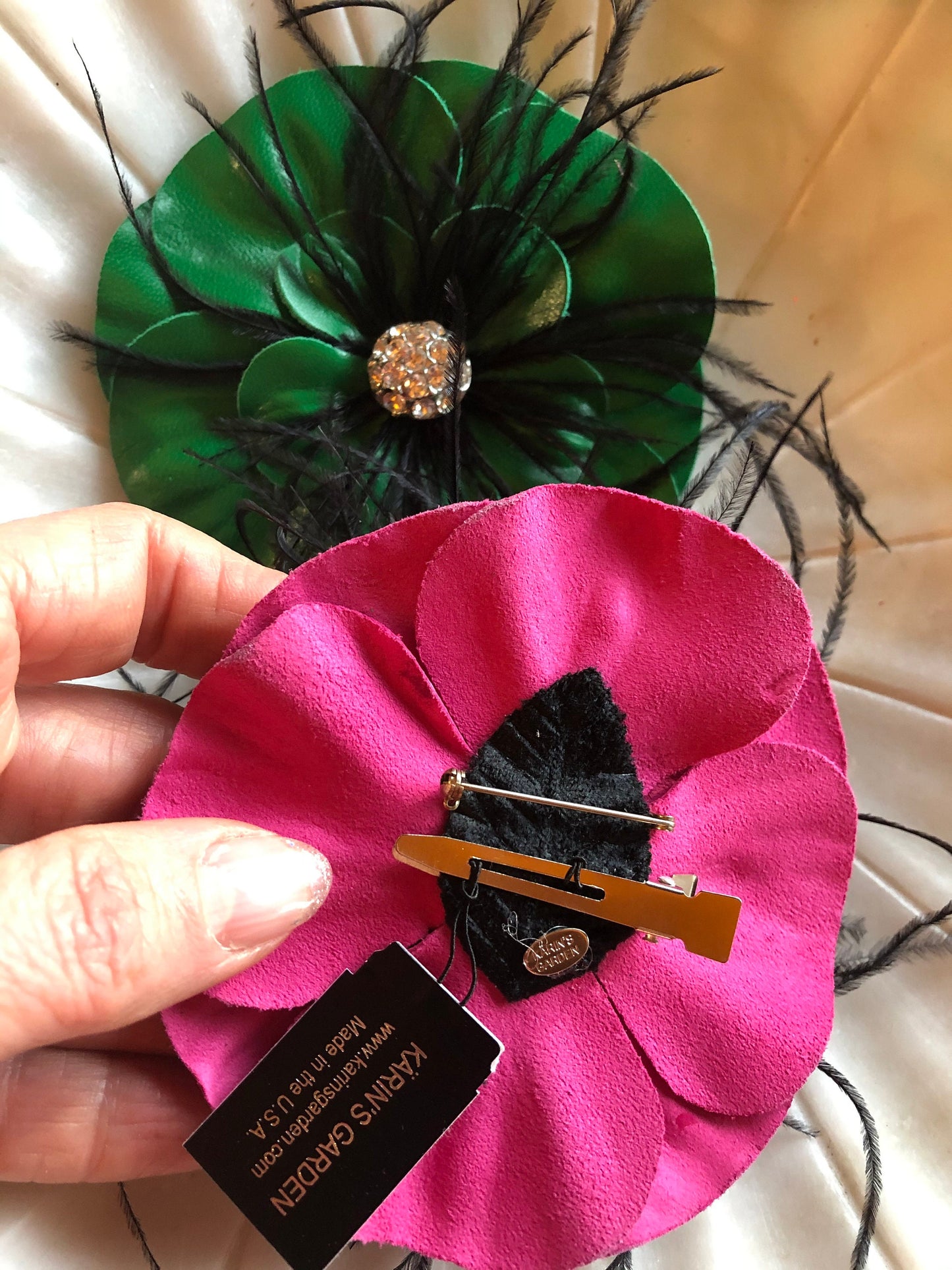 Karin's Garden 4" Leather Camellia Pin and Pinch Clip.   Feathers and rhinestones in the center.  Handmade in the USA.